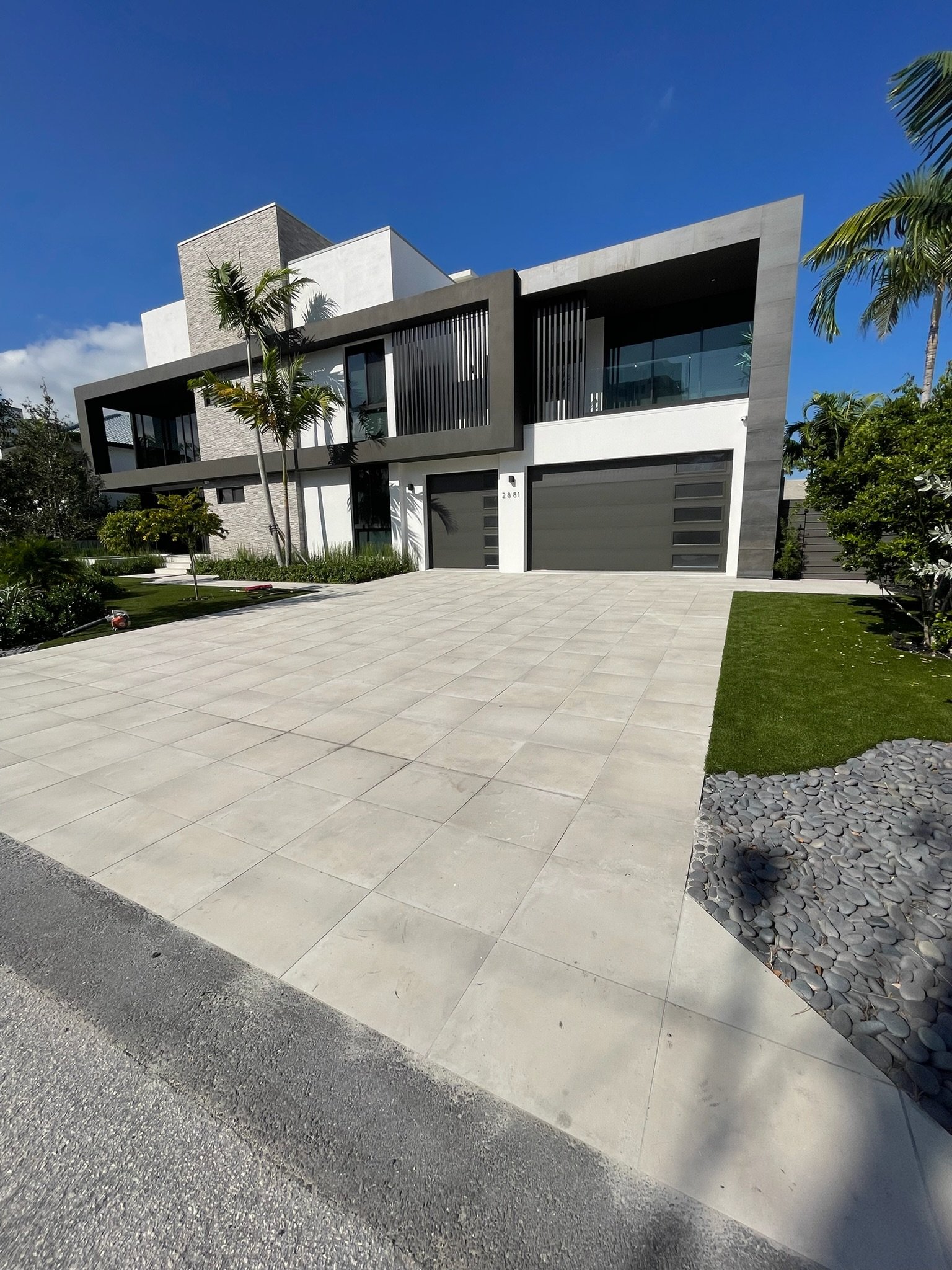Travertine waterfront pool deck and outdoor kitchen South Florida