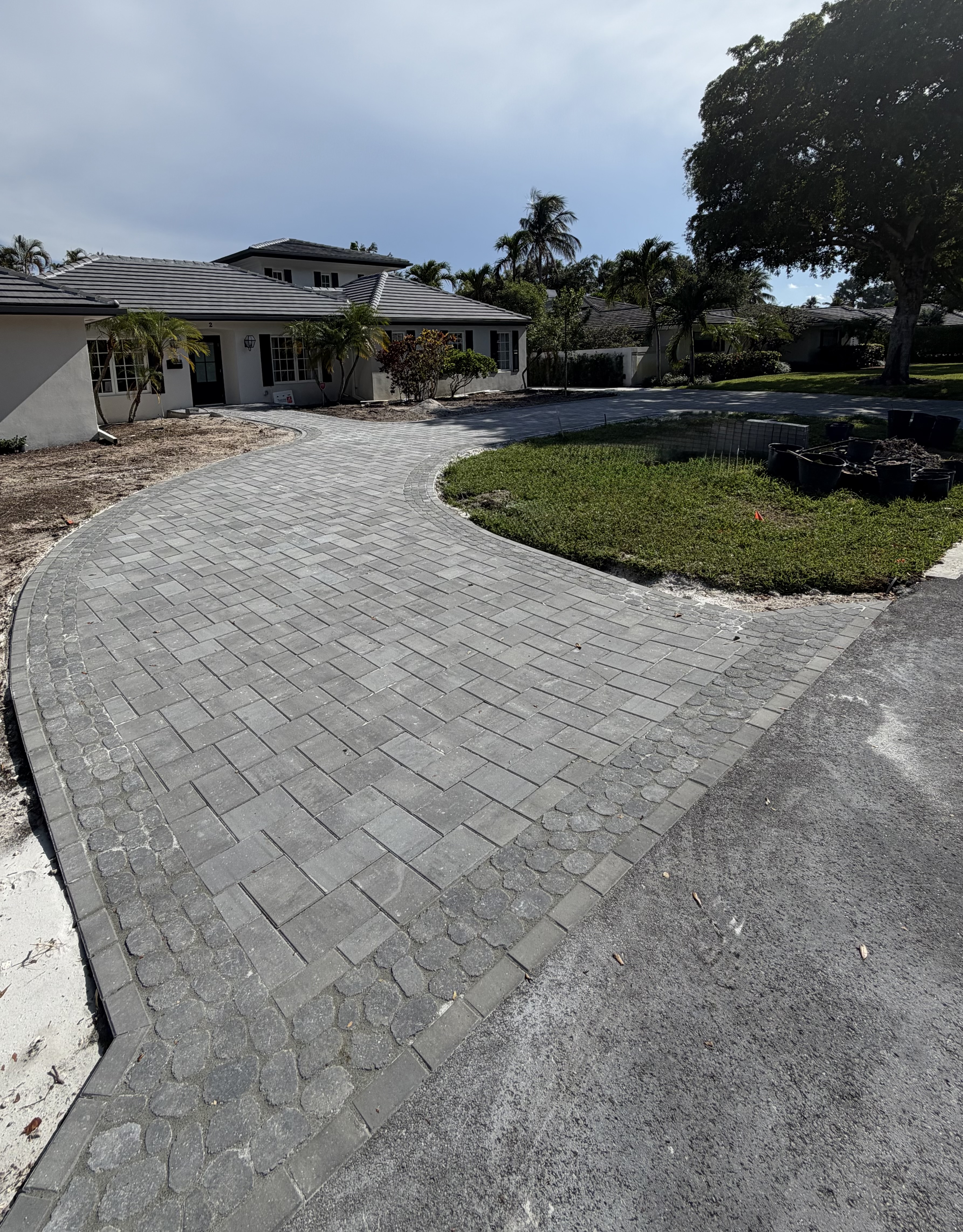Curved paver driveway installation South Florida by Primos Pavers